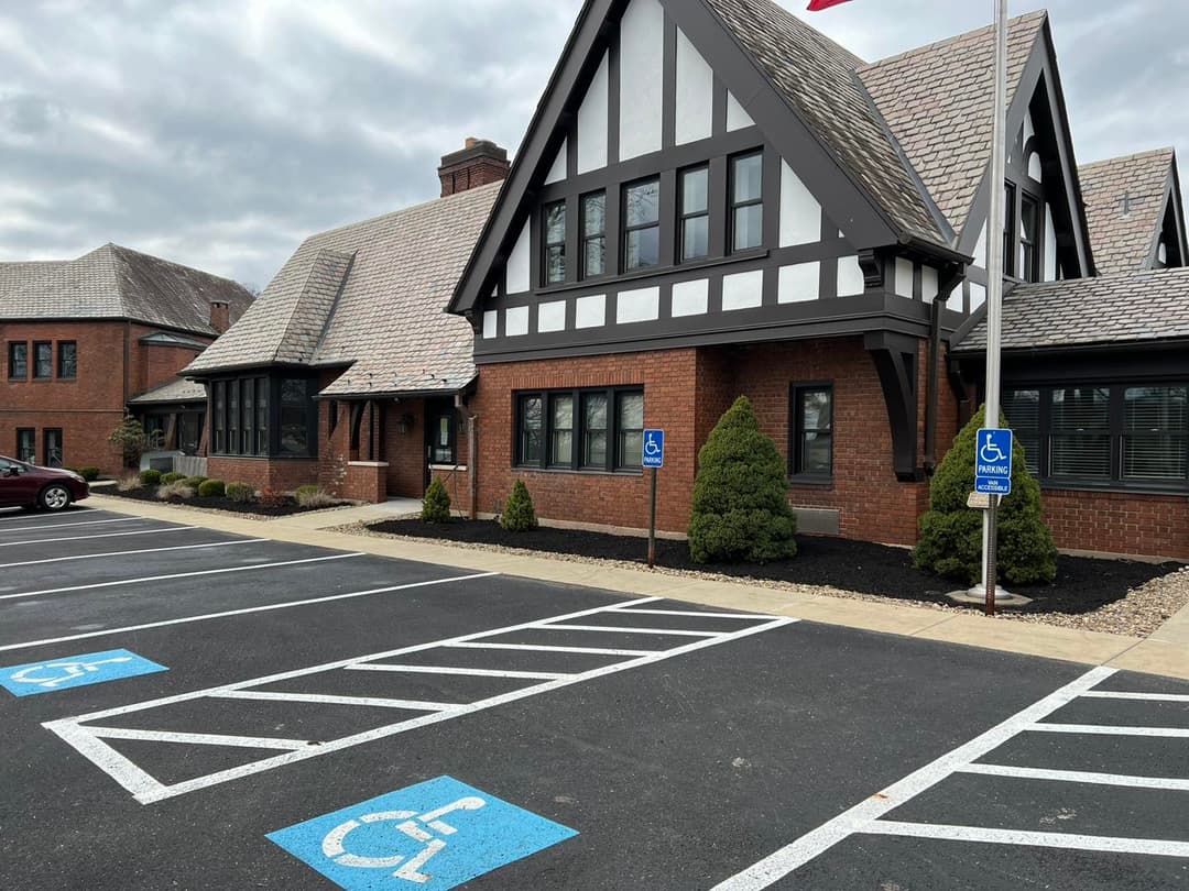 Historic building with accessible parking spaces and landscaped grounds. Ideal for visitors.